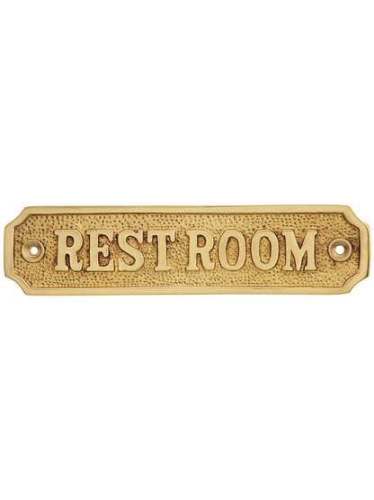 Cast Brass Restroom Sign in Polished Brass.